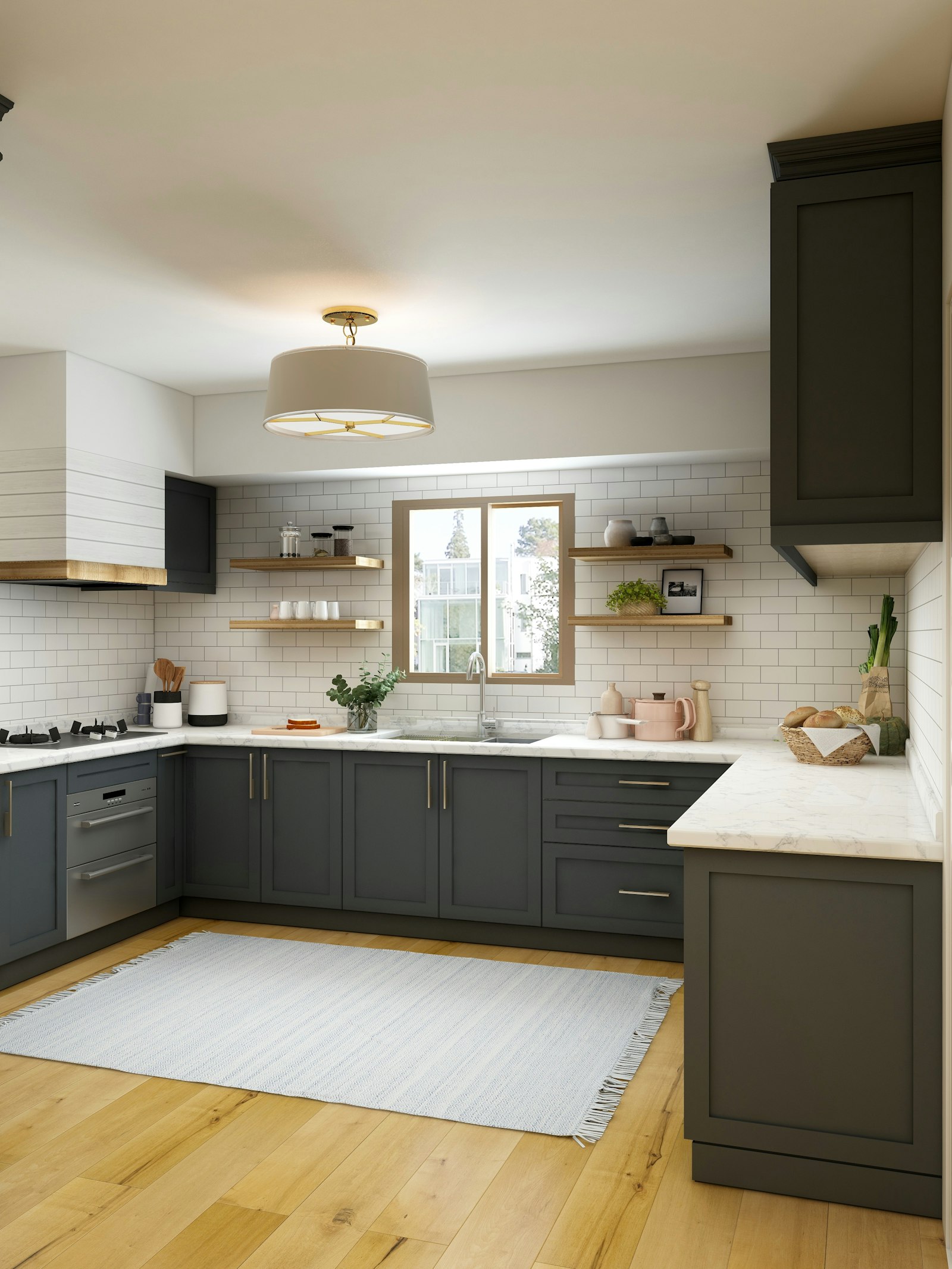 A kitchen with slate-gray cabinets, a marble counter, white subway tile, and a pine floor
